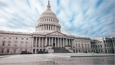 Capitol building with cloudy sky